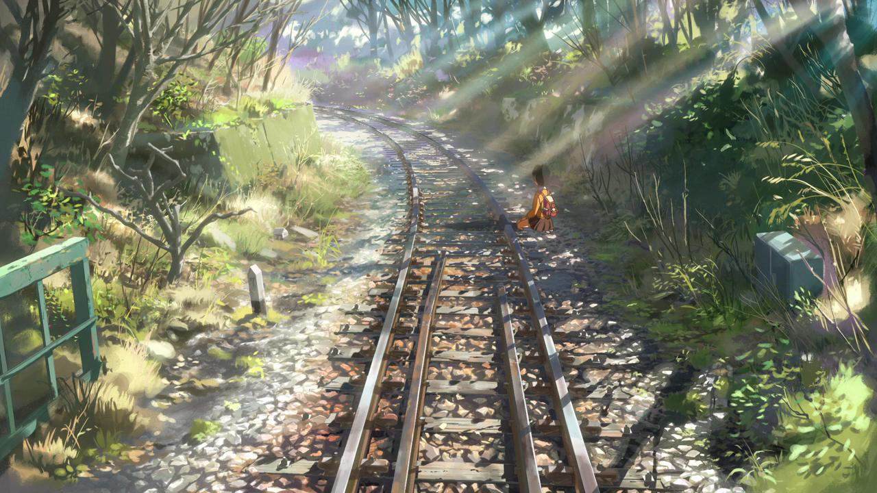 Asuna assise le long d'une voie ferrée